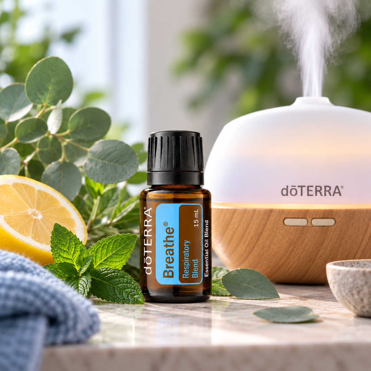 doTERRA Breathe Respiratory Blend Essential Oil 15ml beside an essential oil diffuser