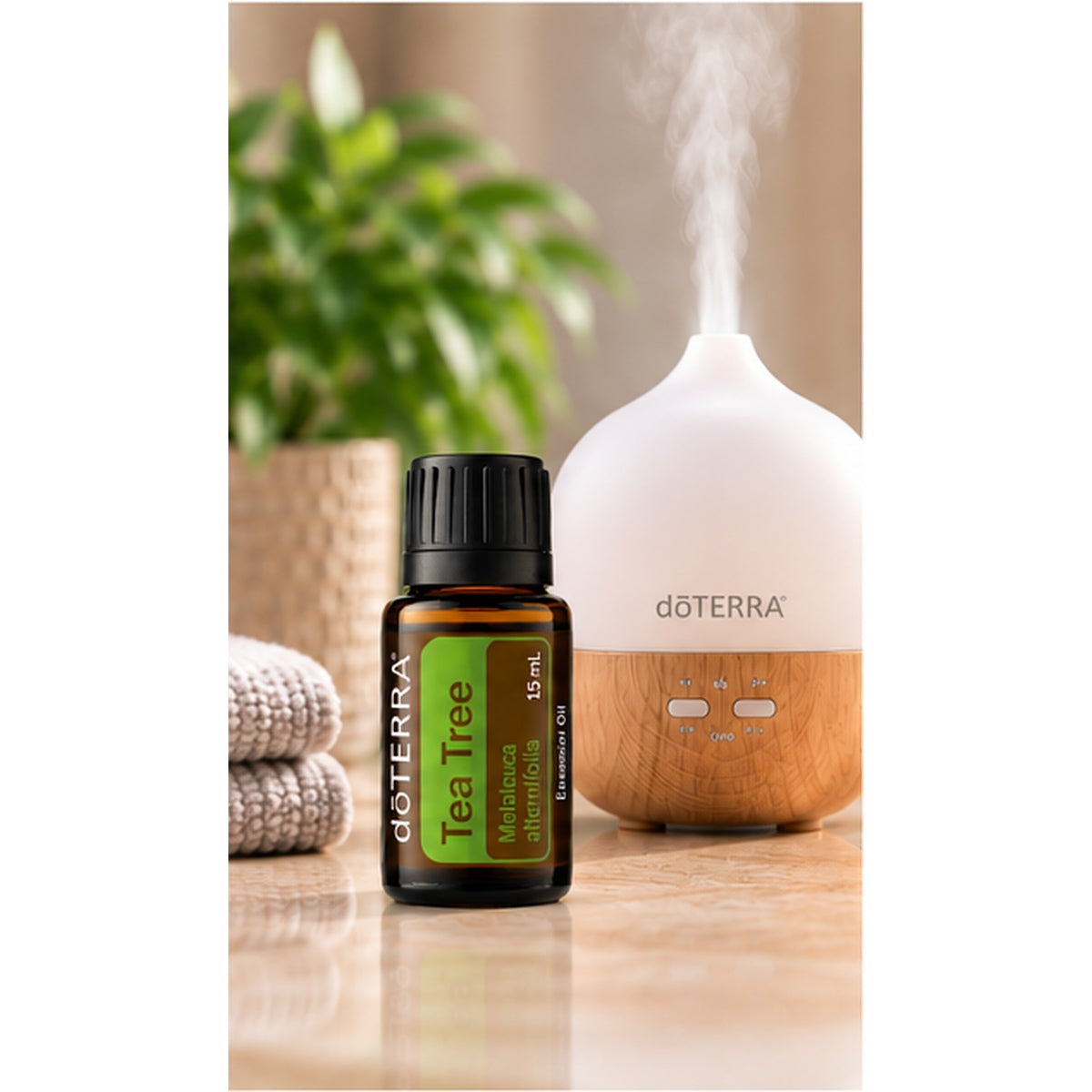 doTERRA Tea Tree Essential Oil beside an essential oil diffuser